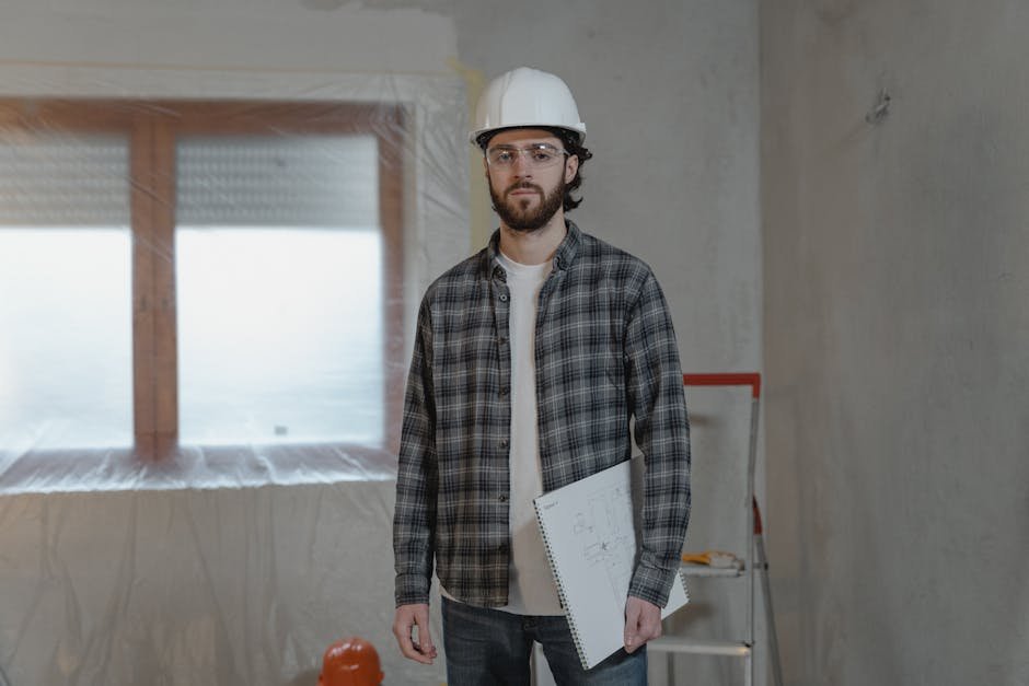 contractor checking blueprints and permits - home improvement contractors contractor checking blueprints and permits - home improvement contractors