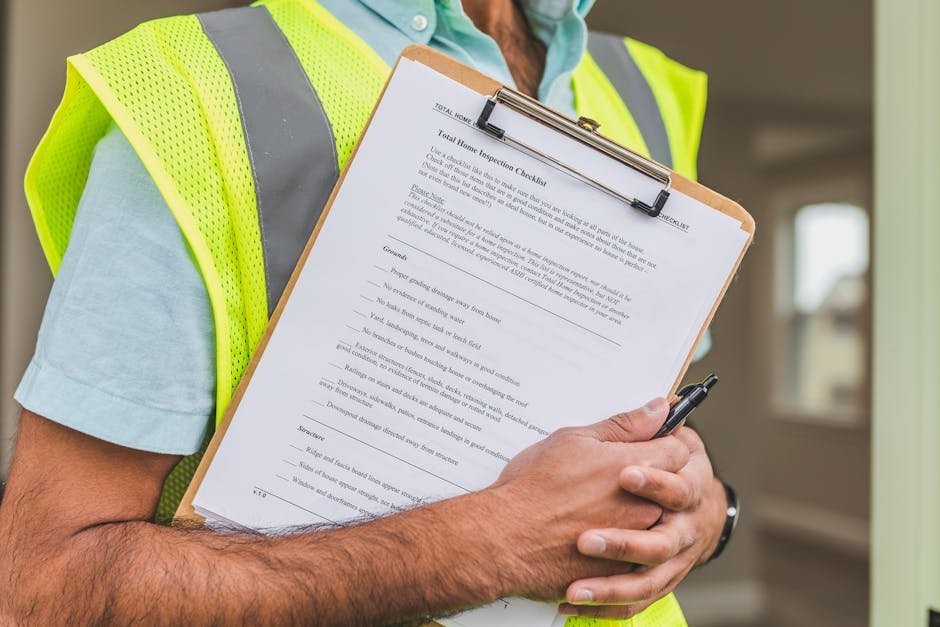 construction worker reviewing safety checklist - home improvement contractors construction worker reviewing safety checklist - home improvement contractors